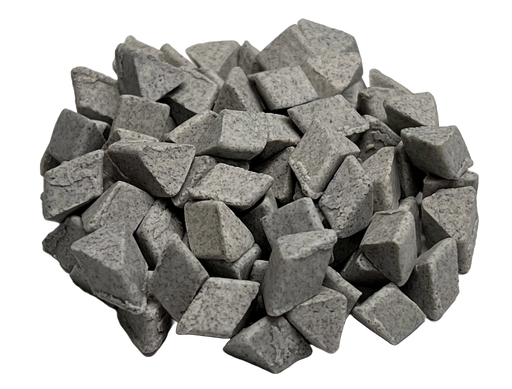 Image shows a pile of ceramic abrasive media for surface finishing from PostProcess