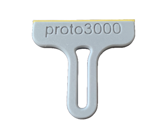 The image shows a small 3D-printed squeegee