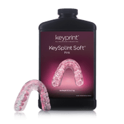 Image of KeySplint Soft Pink Resin with a 3D printed mouthguard on the side