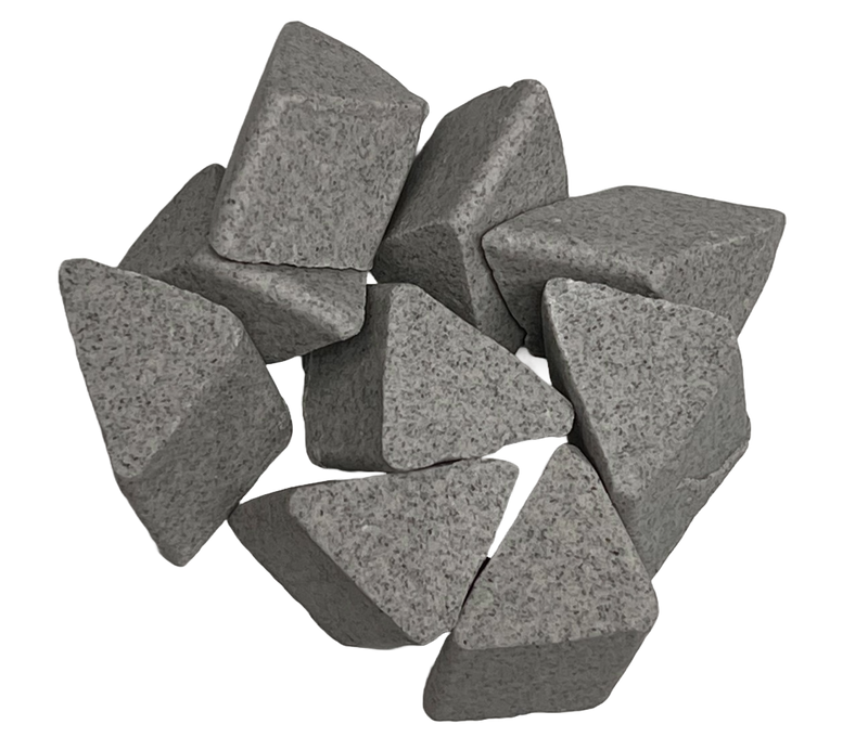 Image shows a pile of M-CATL ceramic abrasive triangle large surface finishing from PostProcess