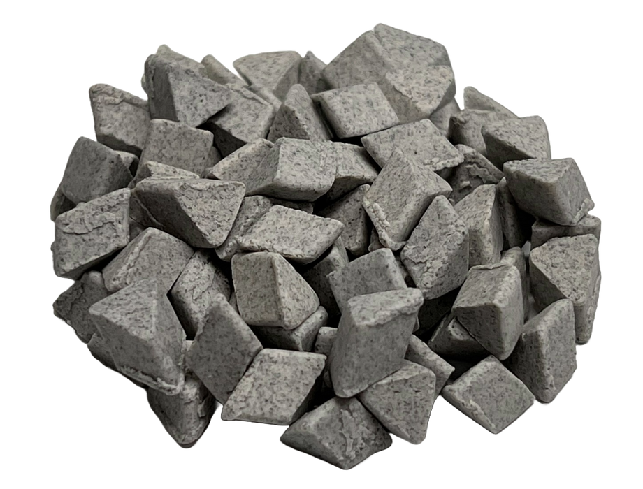 Image shows a pile of ceramic abrasive media for surface finishing from PostProcess