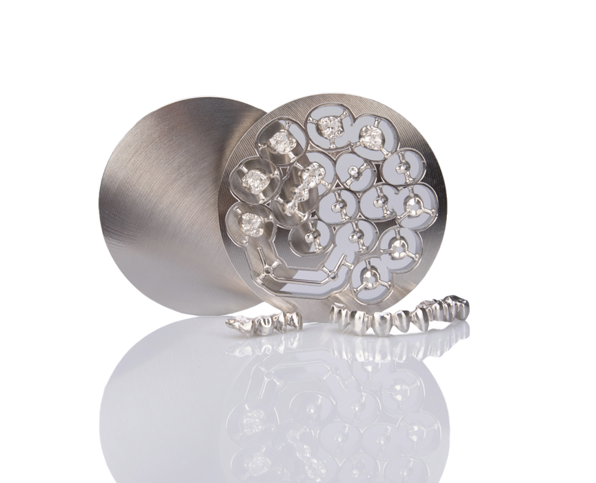 Image shows Titanium Grade 23 disc from MESA Italia milled with dental indications