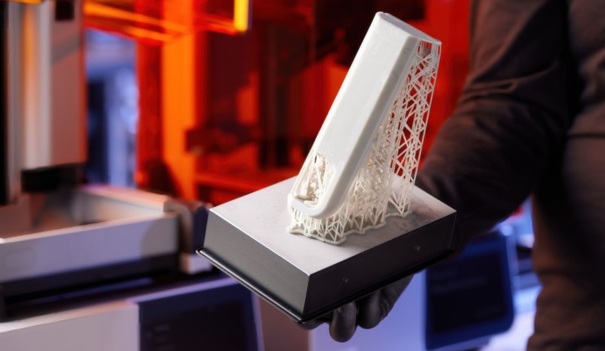 Image of Formlabs Form 4 Build Platform with a 3D printed part produced with Formlabs Fast Model resin