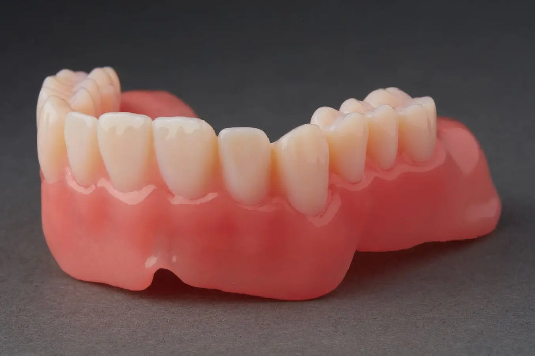 Image shows a 3D printed denture produced with Formlabs Premium Teeth resin