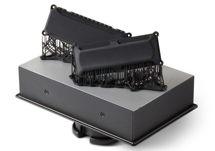 Formlabs Black Resin V.5 for Form 4 SLA 3D Printer | Image of Form 4 Build platform with 3D printed parts in Black resin 