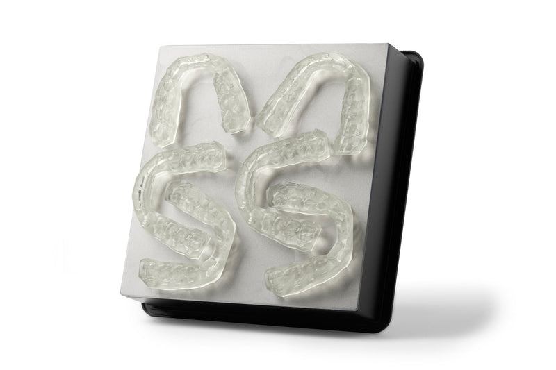 Image shows Form 3B build platform with dental bonding trays 3D printed IBT Flex Photopolymer material