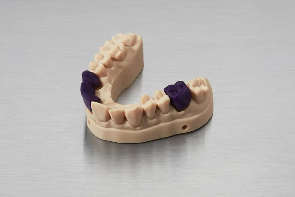 Image shows dental partials and models 3D printed with Formlabs Castable Wax Resin for SLA 3D printing